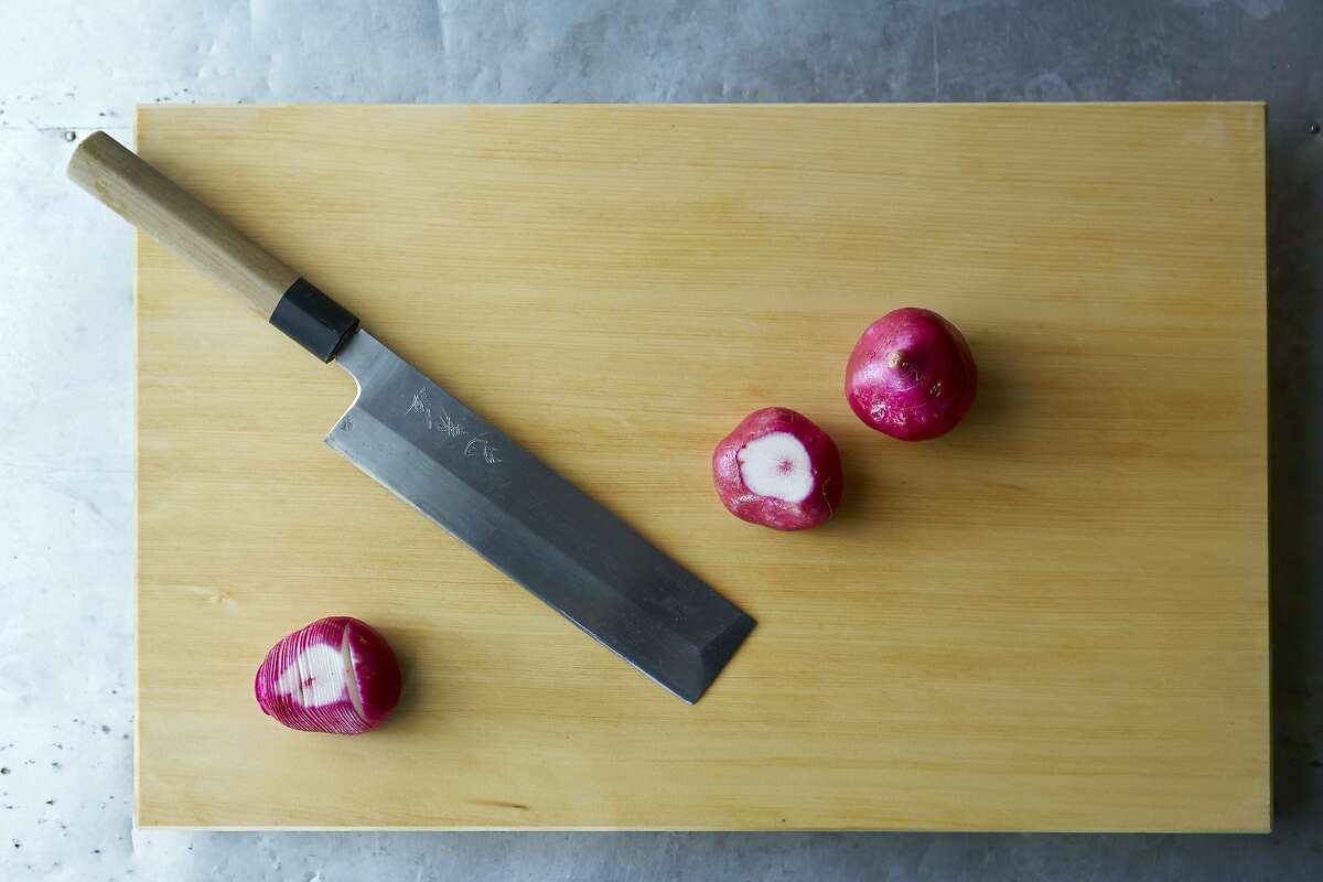 A Japanese vegetable knife in Sylvan Brackett's backyard culinary lab.