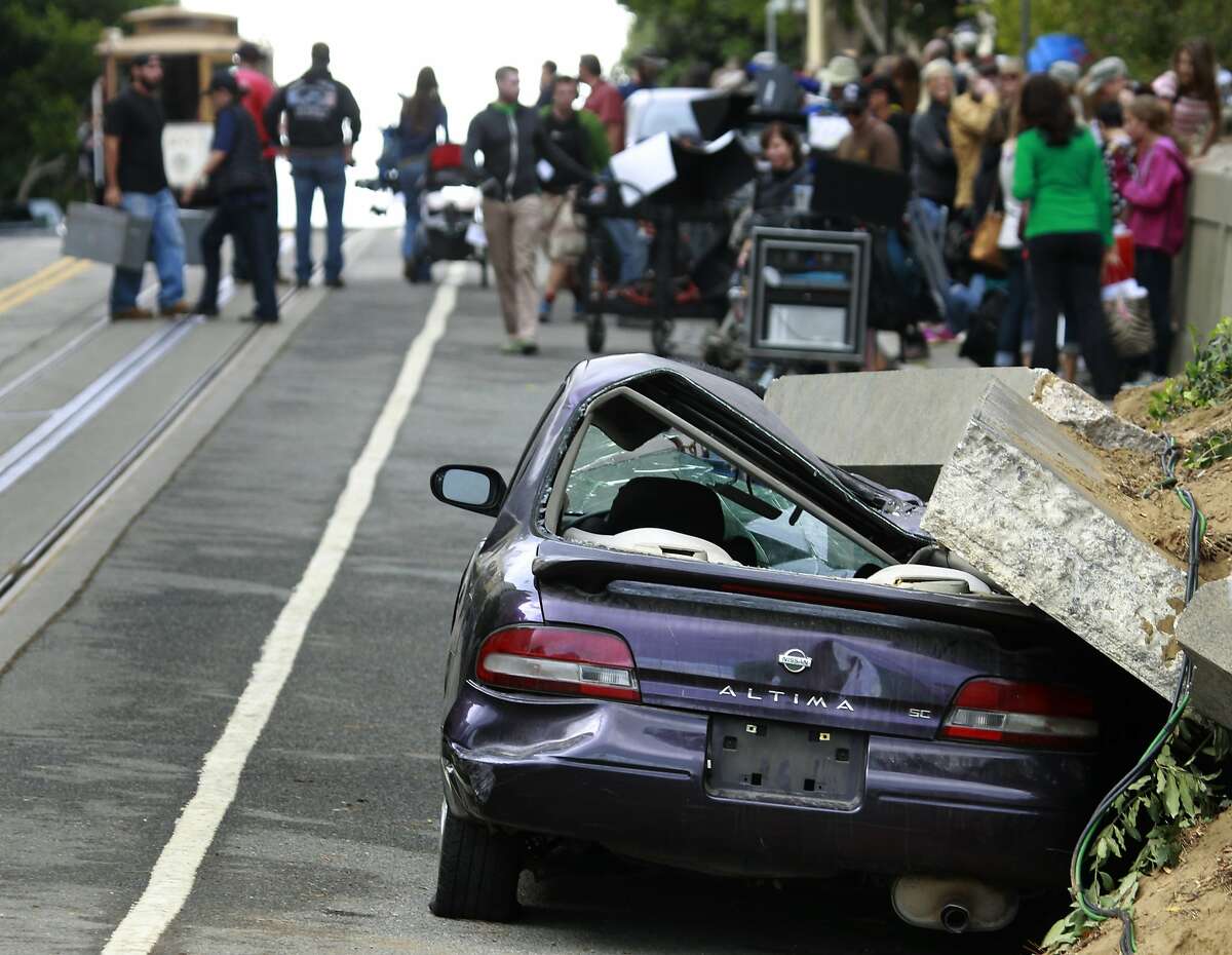 A production crew prepares to shoot a scene for the film "San Andreas" on Hyde Street in San Francisco, Calif. on Tuesday, July 22, 2014. Actor Dwayne Johnson stars in the earthquake disaster movie scheduled to be released in 2015.