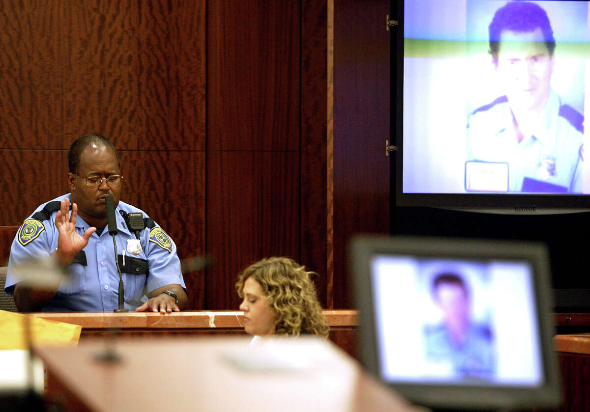October 10, 2005 Officer Baylous of the Houston Police Department testifies at the trial of Alfred Dewayne Brown who is charged with capital murder in the shooting death of Officer Charles Clark on April 3, 2003. Officer Baylous was an officer on the scene at the time. Officer Roland Baylous of the Houston Police Department on Monday describes at the trial of Alfred Dewayne Brown how police found the slain officer and clerk at a check-cashing shop.