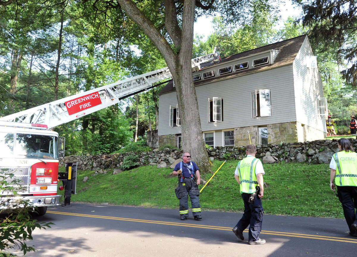 Scene of the aftermath of a structure fire at 6 Ridgeview Ave., Greenwich, Conn., Tuesday afternoon, July 22, 2014. Town of Greenwich Deputy Fire Chief Keith Millette said the fire alarm came in at 4:30 PM and that fire and smoke were visible when the firefighters arrived shortly after that. Millette also said that there was no one home at the time of the fire except for a dog that firefighters rescued and was unharmed.