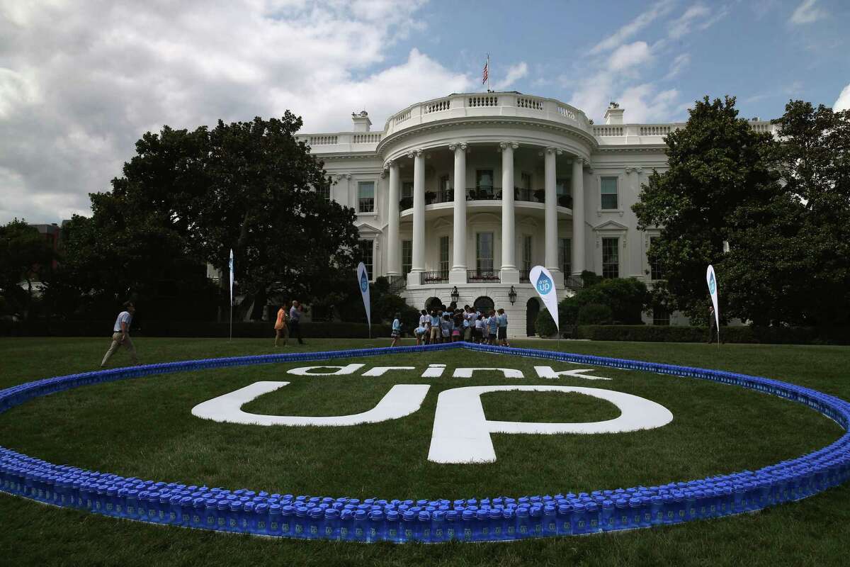 Water bottles are lined up as a heart on the south lawn of the White House as first lady Michelle Obama and children from the YMCA, promote drinking more water July 22, 2014 in Washington, DC. 