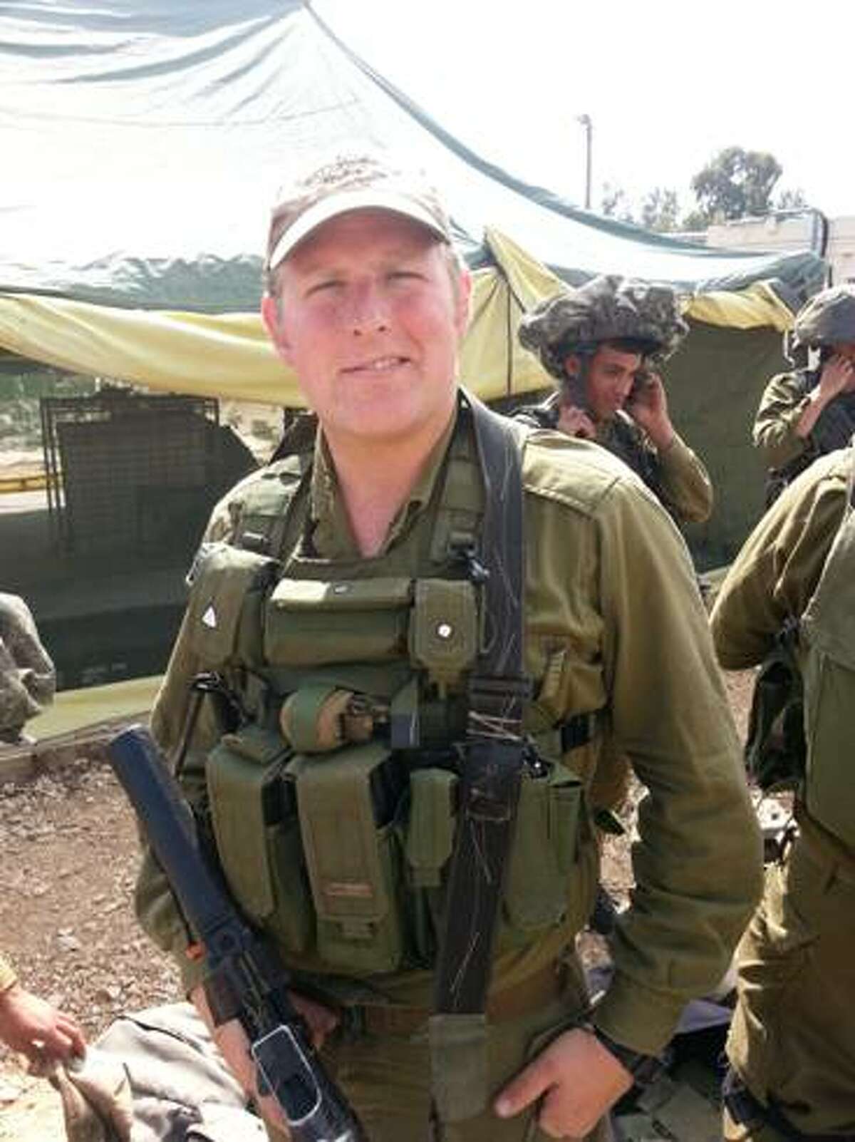 Zach Garber found a way to get into Israel despite the FAA ban on air travel from the United States. Caption: Zach is in good spirits before starting his battalion exercise. From March, 2014. Family photo