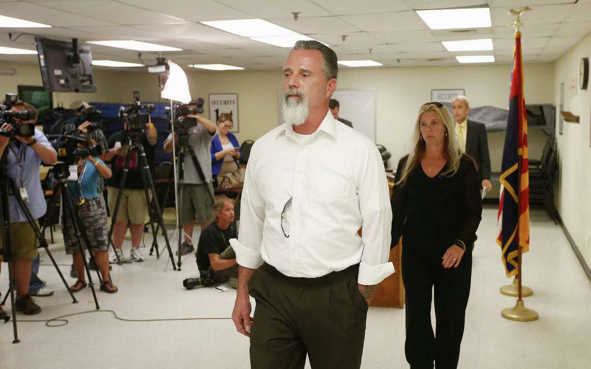 Richard Brown and his wife, Jeanne, leave after speaking during a news conference following the execution of Joseph Rudolph Wood at the Arizona state prison on Wednesday.