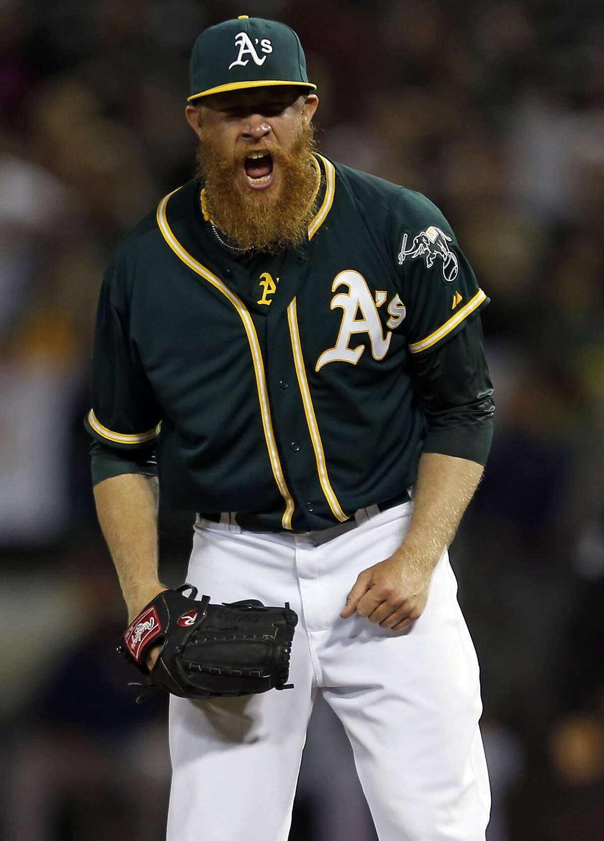 Oakland Athletics' relief pitcher Sean Doolittle reacts to the final out of the A's 9-7 win over the Houston Astros during MLB game at O.co Coliseum in Oakland, Calif. on Wednesday, July 23, 2014.