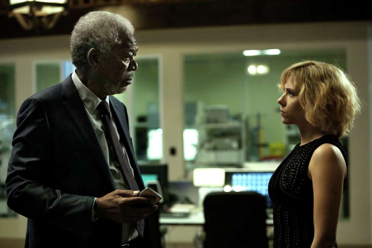 This image released by Universal Pictures shows Morgan Freeman, left, and Scarlett Johansson in a scene from "Lucy." (AP Photo/Universal Pictures, Jessica Forde)