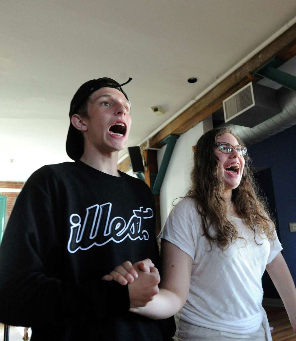 Actors, Django Vaz, 17, left, and Meredith Martin, 18, during the Off-Beat Players rehearsal of Spamalot at the Arch Street Teen Center, Greenwich, Conn., Thursday night, July 24, 2014. The Off-Beat Players is a long-running theater program that brings together children both with and without special needs in all roles of the show. Spamalot will run August 6th through August 9th at the center.