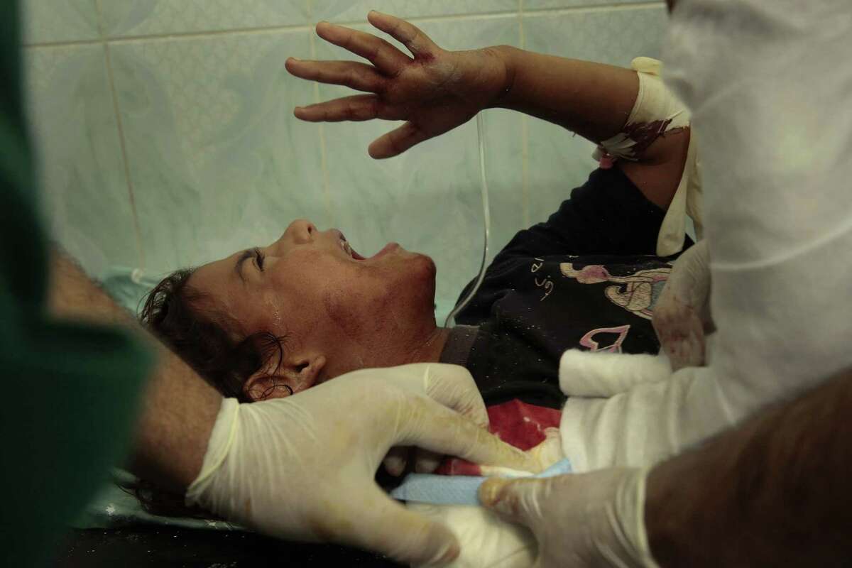 U.N. school in Gaza caught in crossfire; 15 killed