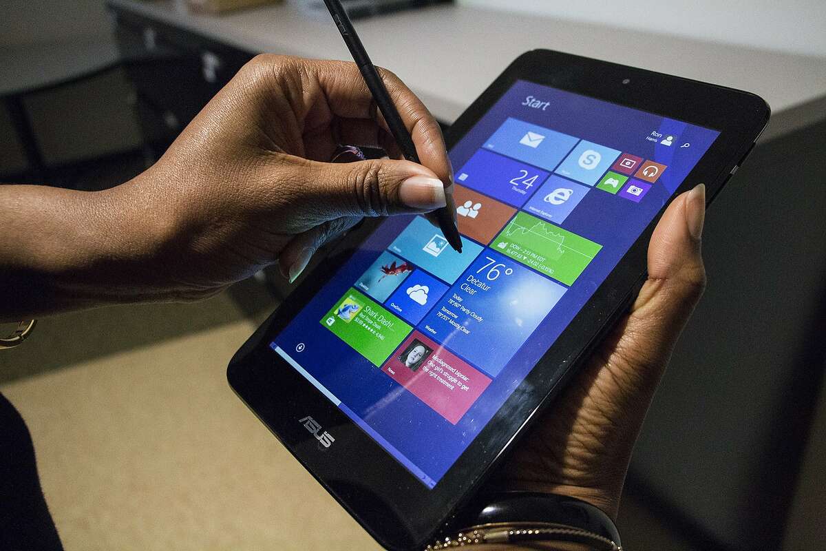 This April 24, 2014 shows the ASUS VivoTab Note 8 tablet computer, in Atlanta. The Note 8 runs a full version of Microsoft's Windows 8 operating system and comes with a Wacom stylus pen for use with the screen that has 1024 levels of pressure sensitivity. (AP Photo/Ron Harris)