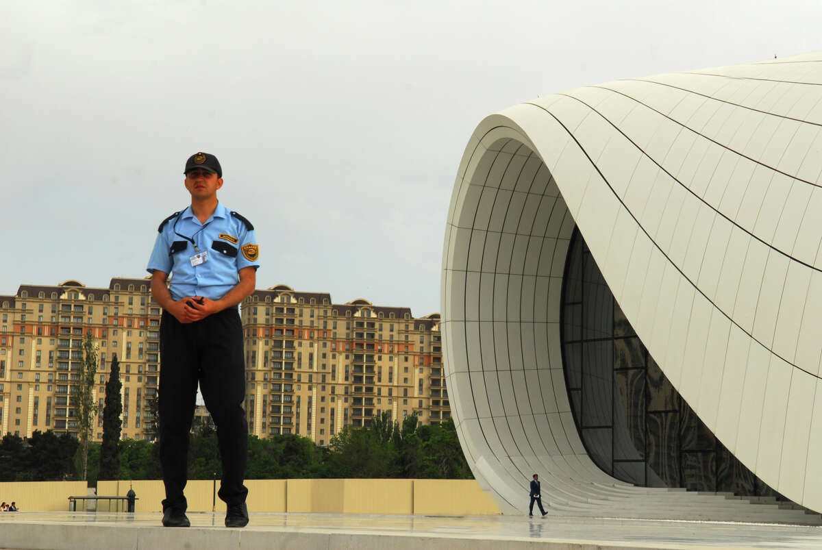 Security guards were posted outside the Heydar Aliyev Center in Baku, Azerbaijan, the site of the 2013 conference organized by Houston businessman Kemal Oksuz.