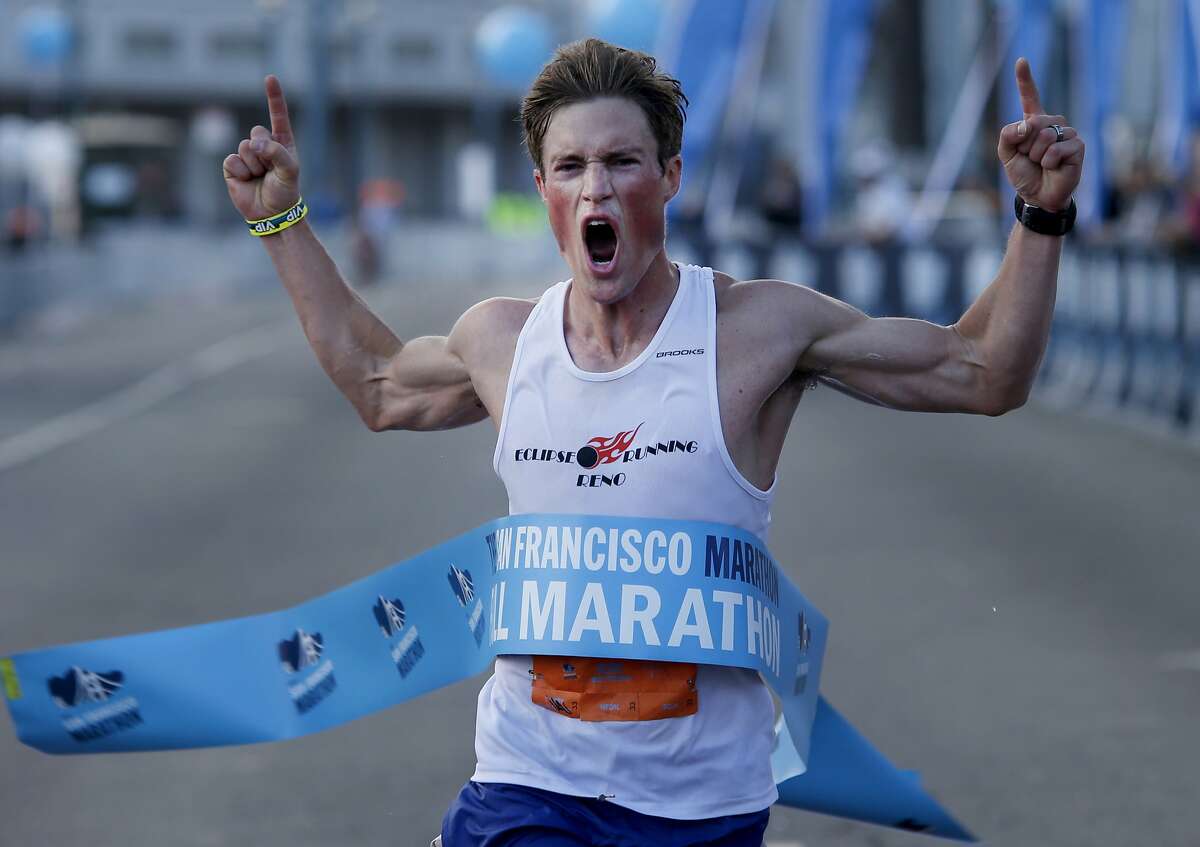 August Brautigam of Reno, Nevada celebrated his first place finish for the men's marathon. Thousands of runners ran through the streets in the annual San Francisco Marathon held Sunday July 27, 2014.