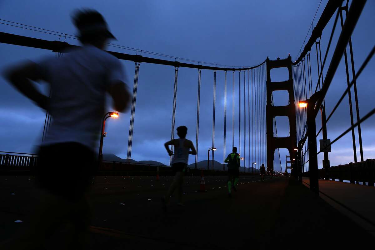 Some of the first runners cross the Golden Gate Bridge during the San Francisco Marathon in San Francisco, Calif. on Sunday, July 27, 2014.
