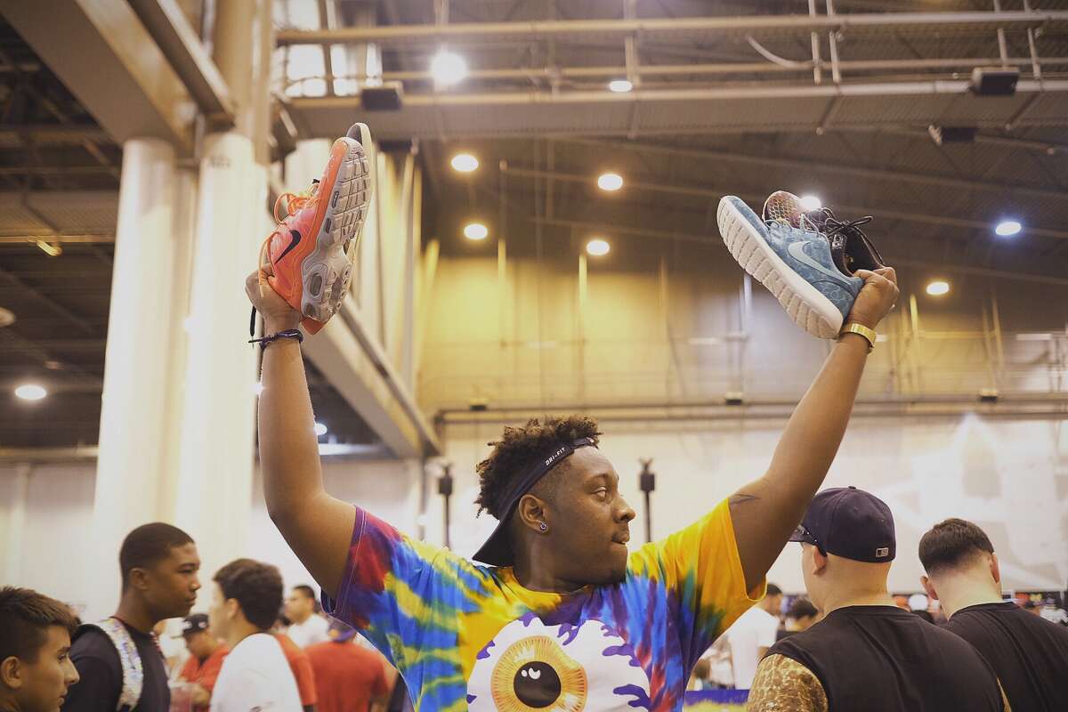Jamarai Nelson looks to sell sneakers during the 2014 H-Town Sneaker Summit﻿ on Sunday﻿ at NRG Park﻿.﻿ The event has grown to host thousands of people since its inception in 2004.