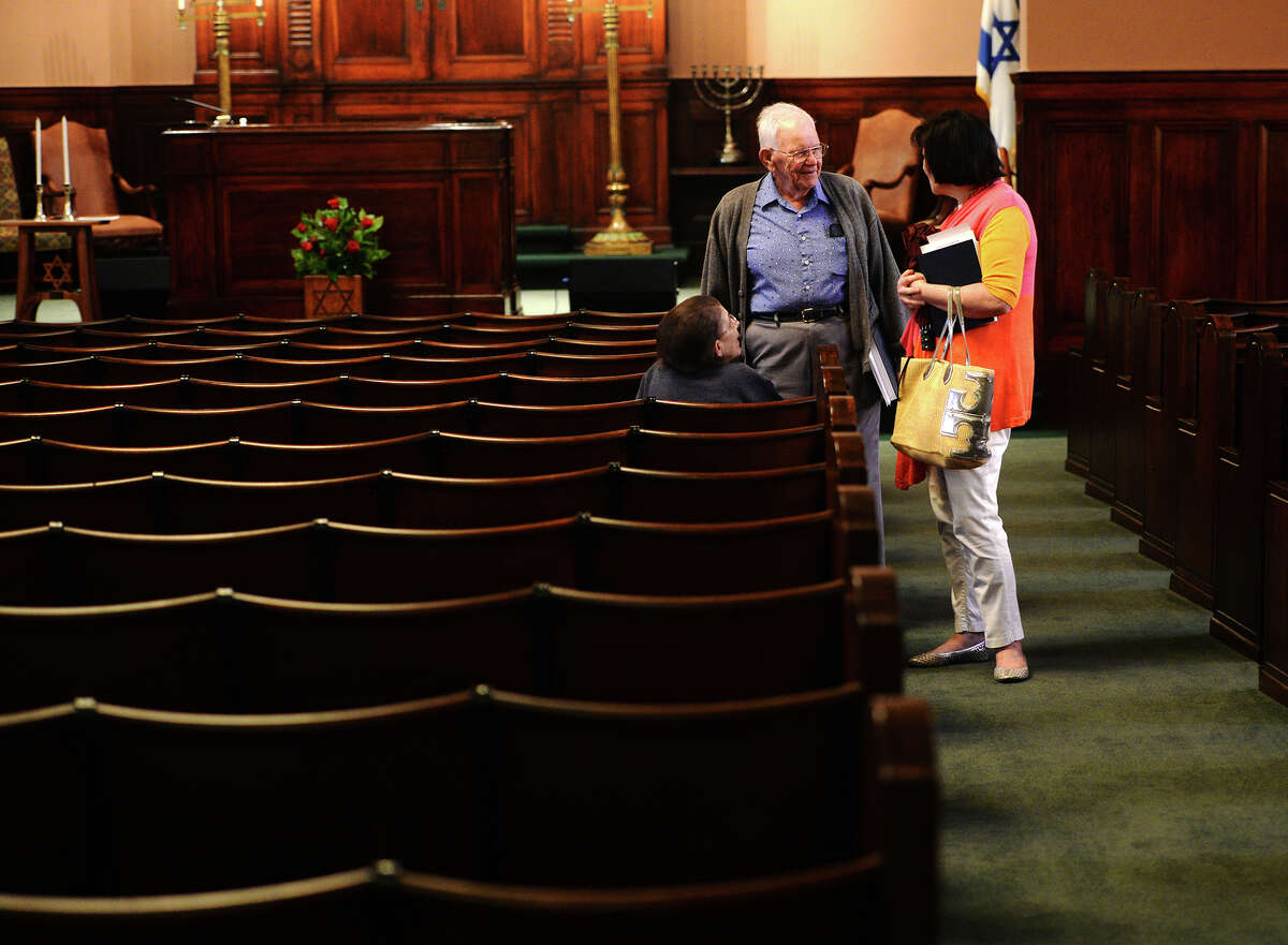 Linda and Herb Goldstein, left and center, talk with Mindy Eisen before Shabbat services Friday. Rabbi Joshua Taub led Friday night Shabbat services at Temple Emanuel, the area's only Jewish place of worship. The temple could be in danger of closing down sometime in the future due to sagging membership. Photo taken Friday 7/25/14 Jake Daniels/@JakeD_in_SETX