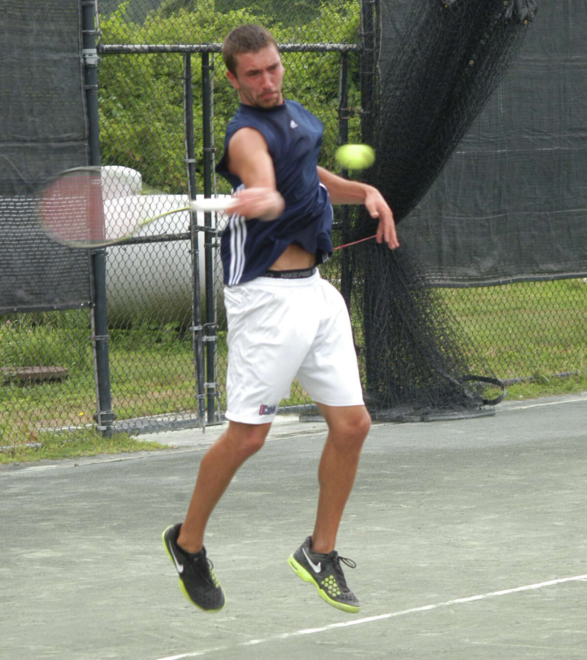 Nic Visinski sending a shot back to Joshua Heilweil on Sunday, July 27 at the men's open singles final at the annual Fairfield Town Tennis Tournament at the Fairfield Tennis Center. Visinski lost the championship to Heilweil by scores of 4-6, 6-1, 6-1.
