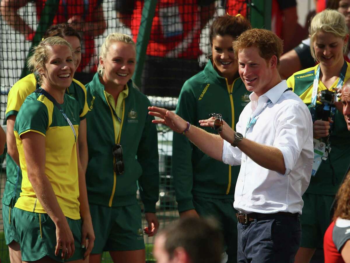 Prince Harry greets members of the Australian and the England women's hockey teams at Glasgow National Hockey Centre during day five of the Glasgow 2014 Commonwealth Games on July 28, 2014 in Glasgow, United Kingdom.