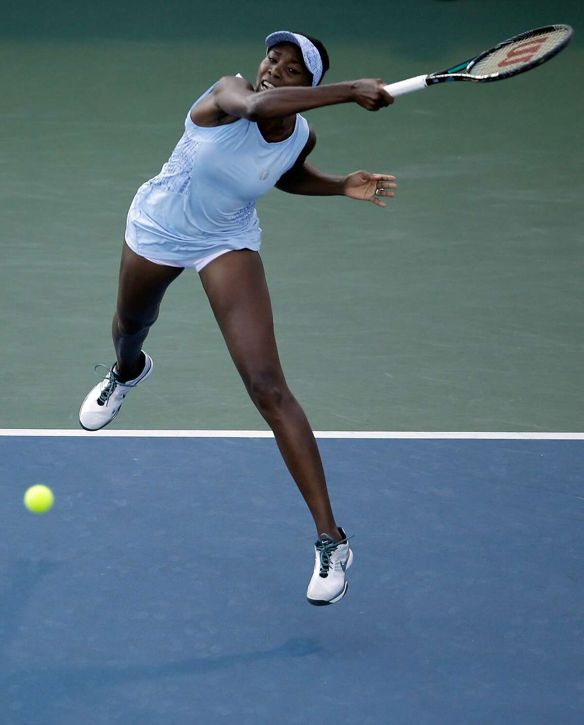 STANFORD, CA - JULY 29: Venus Williams returns a shot to Paula Kania of Poland during Day 2 of the Bank of the West Classic at the Taube Family Tennis Stadium on July 29, 2014 in Stanford, California. (Photo by Ezra Shaw/Getty Images)