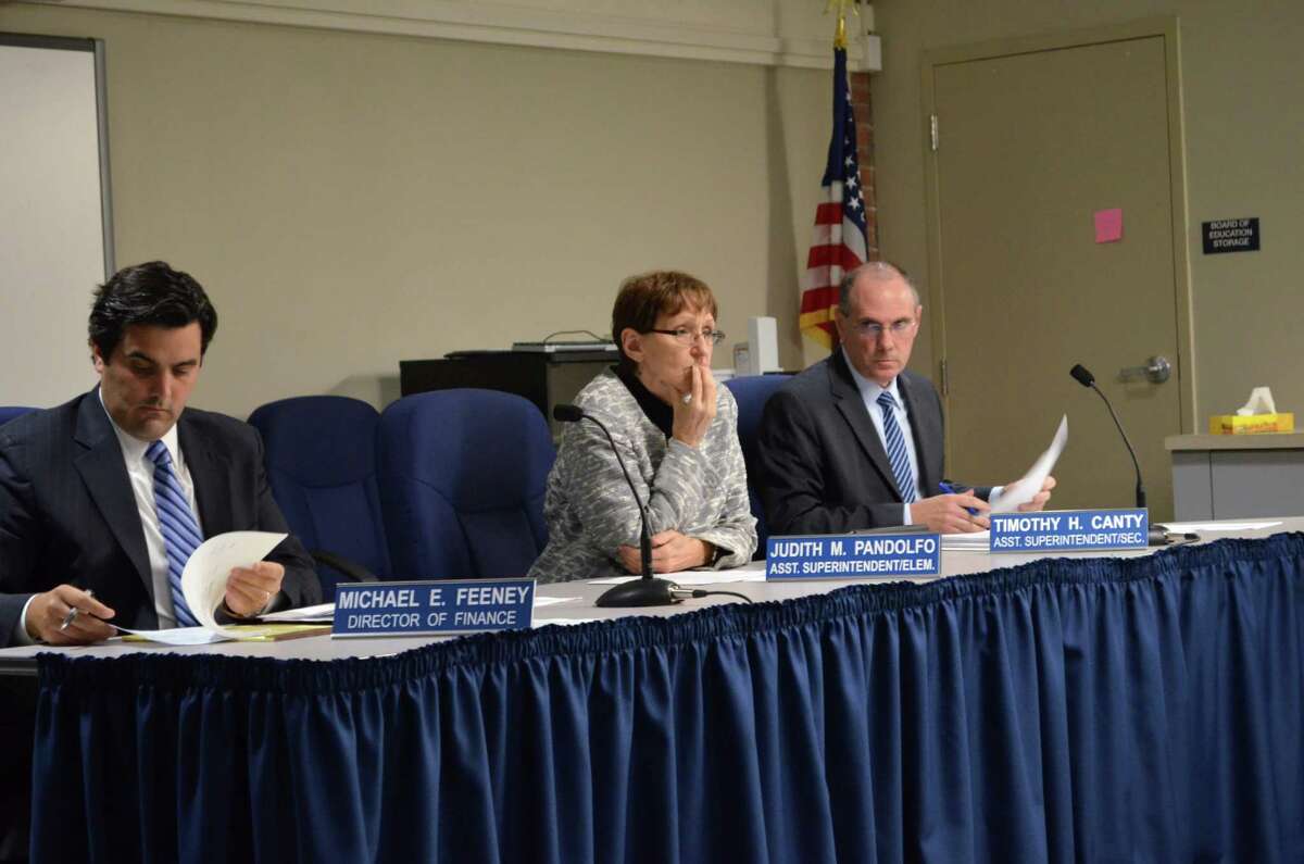 Judith Pandolfo, former assistant superintendent of elementary education, center, will retire from Darien Public Schools, effective June 30, 2015. At a recent public meeting, she was flanked by Director of Finance Mike Feeney, left, and Tim Canty, right, now the assistant superintendent of K-12 curriculum.