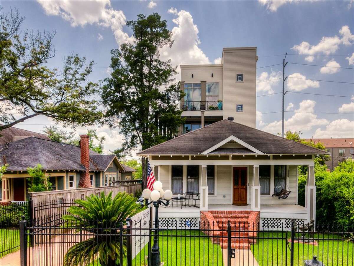 This amazing 4-story Heights home comes with a bonus property out front.