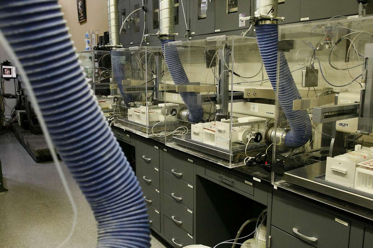 Liquid handlers are seen at Emerald Cloud Labs on Tuesday, July 29, 2014 in Menlo Park, Calif. Companies such as Emerald Cloud Labs offer others to use their machinery to do experiments.