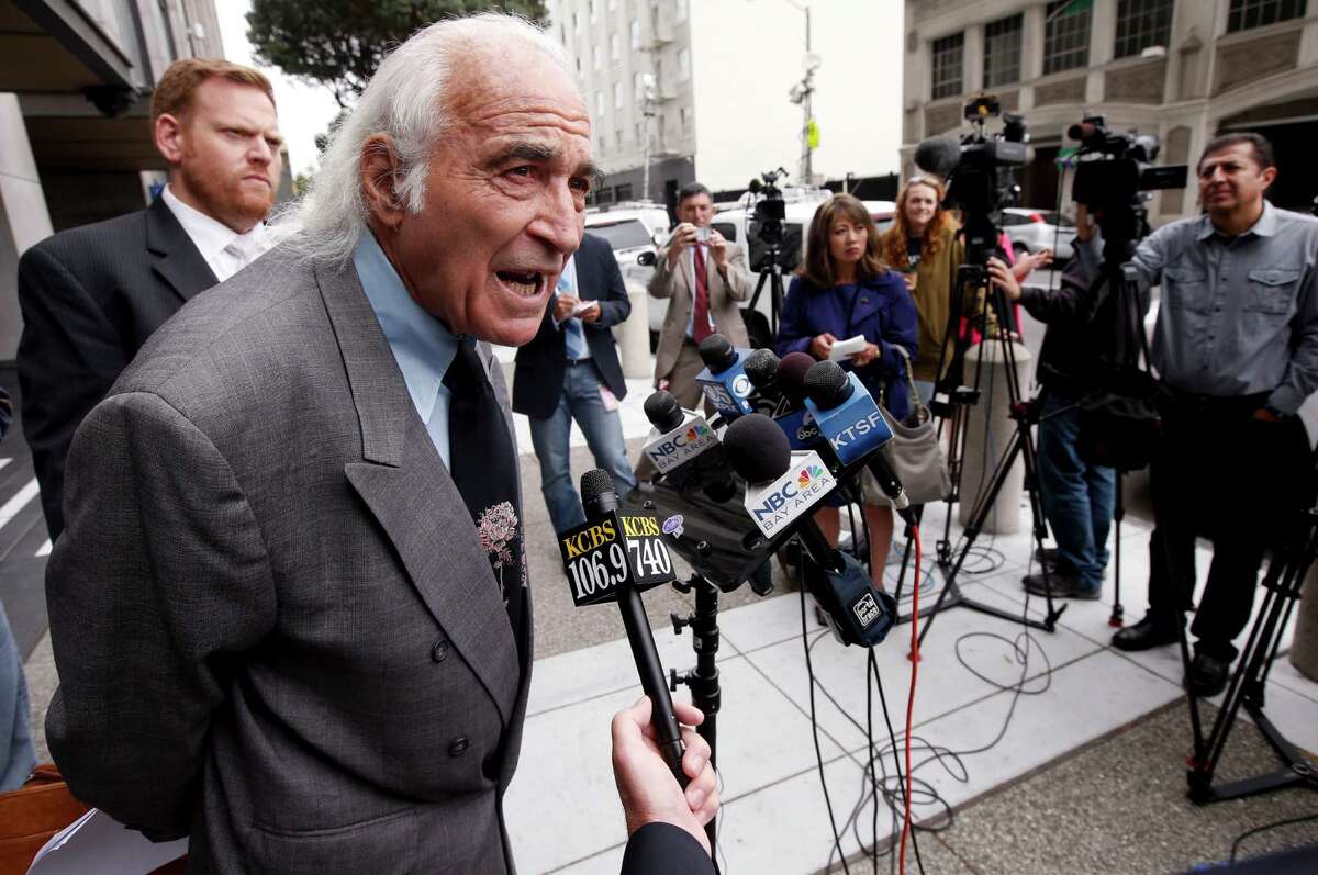 Attorneys Tony Serra and Curtis Briggs (left) speak to the media after their client Raymond "Shrimp Boy" Chow pleaded not guilty in July.