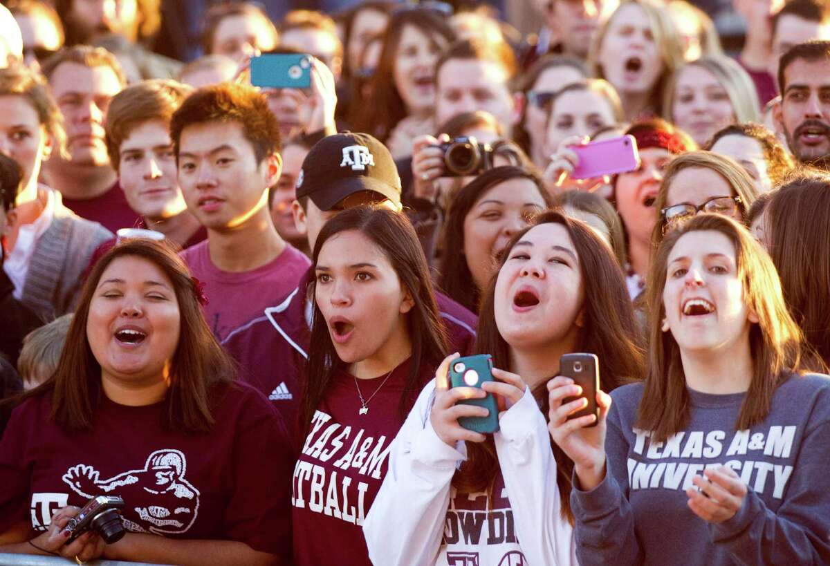 These are College Station residents, students of Texas A&M fondly referred to as "aggies." Note the proud, unified display of A&M colors and school pride that radiates in each person.