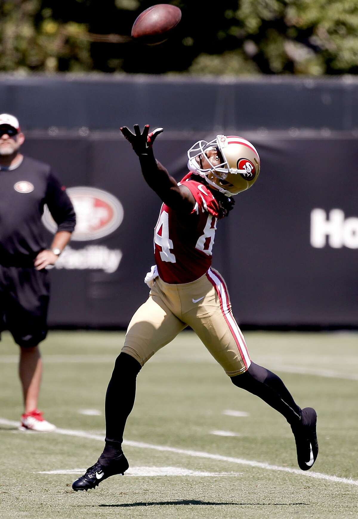 Receiver Brandon Lloyd, (84) reaches out for a pass during drills, as the San Francisco 49ers hold training camp to prepare for the 2014 season in Santa Clara, Calif., on Thursday July 24, 2014.