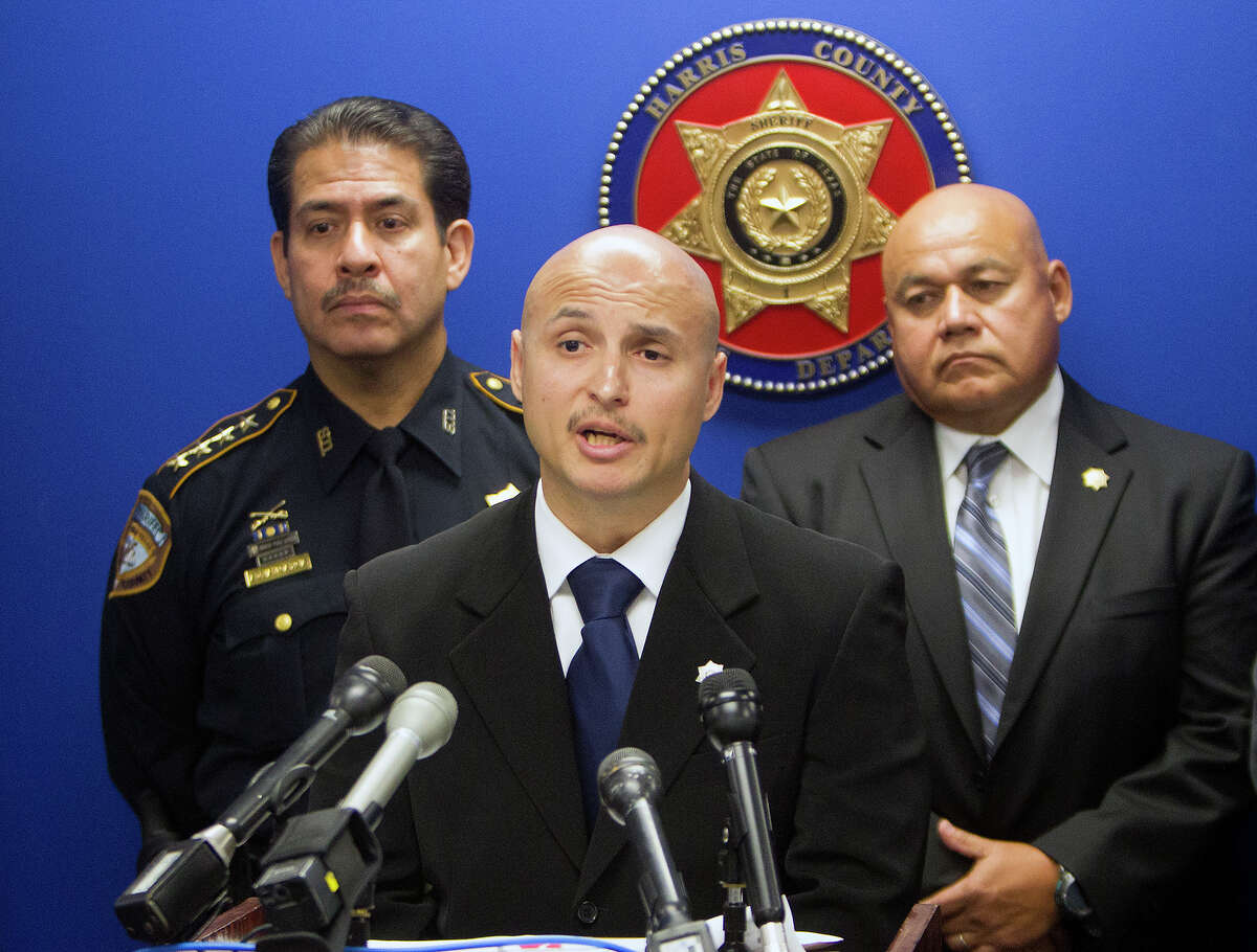 HCSO Sheriff Adrian Garcia, left, Lead investigator Abraham Alanis, and Sgt. Felipe Rivera, right, address the media during a news conference regarding the deaths of the Sun family, Wednesday, July 30, 2014, in Houston. Mei Xie, her husband Maoye Sun and sons Titus and Timothy Sun were killed in their house between 7 p.m. Friday, January 24 and 11 a.m. Saturday, January 25. The HCSO wants to remind the public that information is still needed in their death.