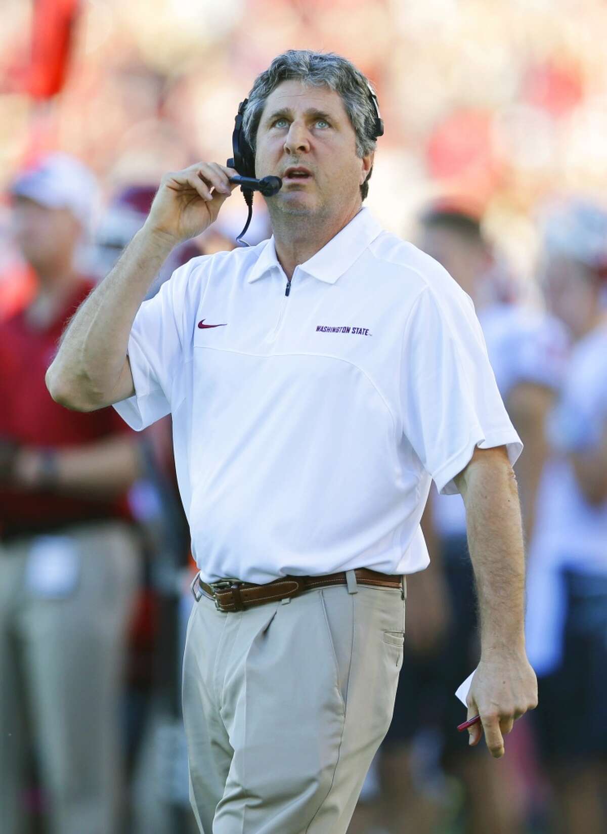 Washington State head coach Mike Leach watches the time clock from the sideline as his team plays Stanford during the first half of an NCAA college football game in Stanford, Calif., Saturday, Oct. 27, 2012. (AP Photo/Marcio Jose Sanchez)