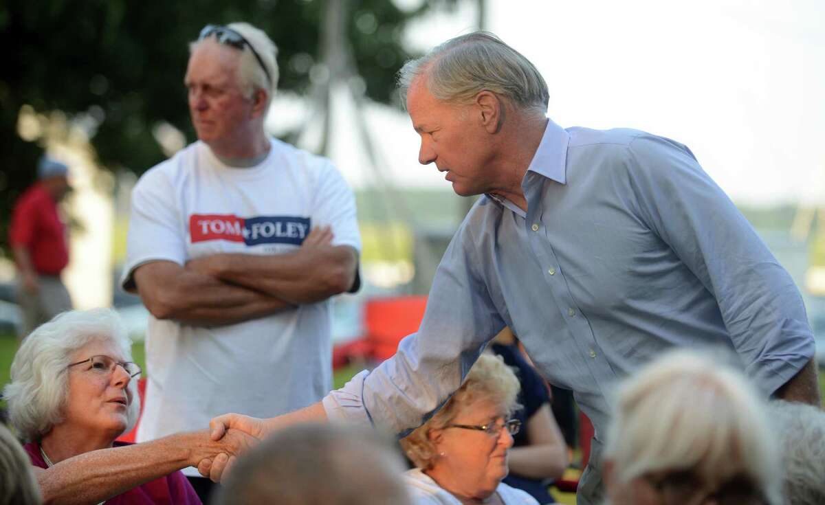 Republican gubernatorial candidate Tom Foley talks with Patti Grabiec, of Trumbull, while on the campaign trail in Stratford, Conn. Thursday, July 31, 2014 at Festival Stratford on the grounds of the American Shakespeare Theater.