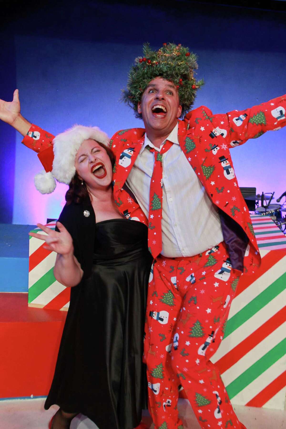 Tamarie Cooper with Greg Dean as Christmas, in this scene from Catastrophic Theatre's "A very Tamarie Christmas," a show spoofing Christmas and other holidays, well-known and virtually unknown.