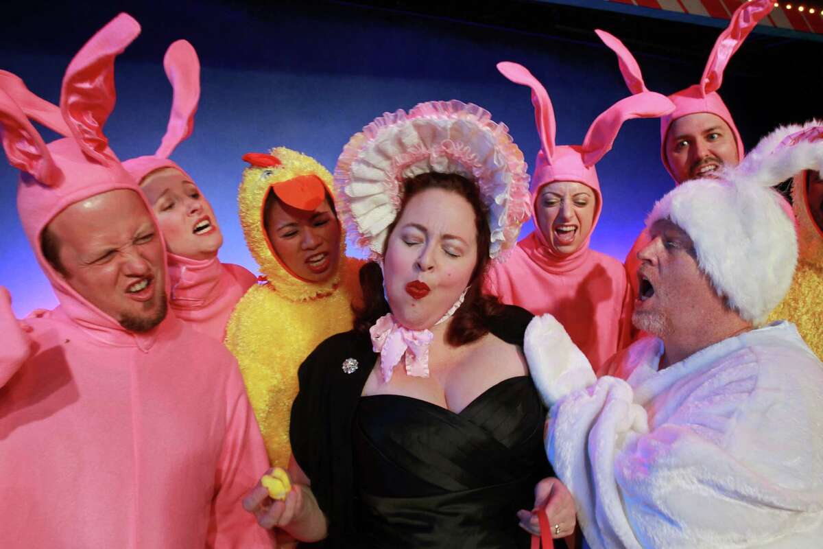 (For the Chronicle/Gary Fountain, July 9, 2014) Tamarie Cooper, center, and Noel Bowers, right, as the Easter Bunny, with the cast in this scene from Catastrophic Theatre's "A very Tamarie Christmas," a show spoofing Christmas and other holidays, well-known and virtually unknown.