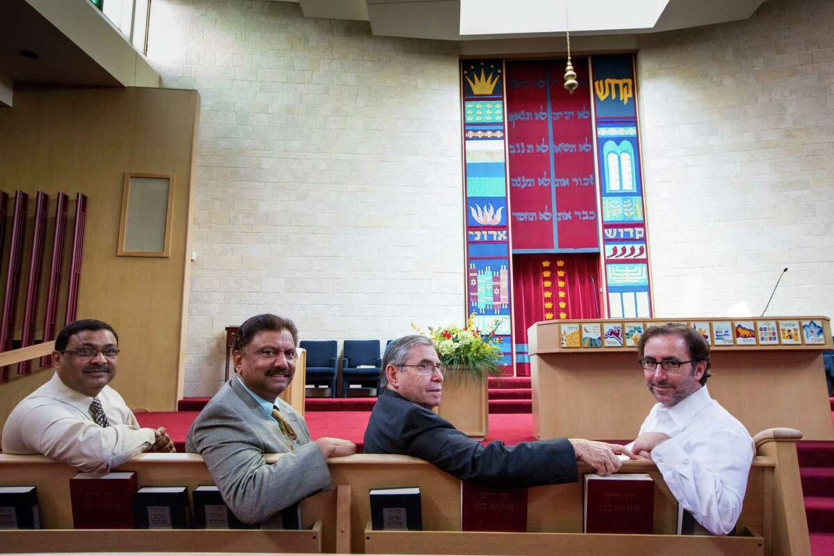 Dr. Aijaz Ali Khowaja, left, Dr. Dilawar Ajani, Rabbi Harvey Rosenstock and Rabbi Ranon Teller July 24, 2014 at Brith Shalom in Houston. (Eric Kayne/For the Chronicle)