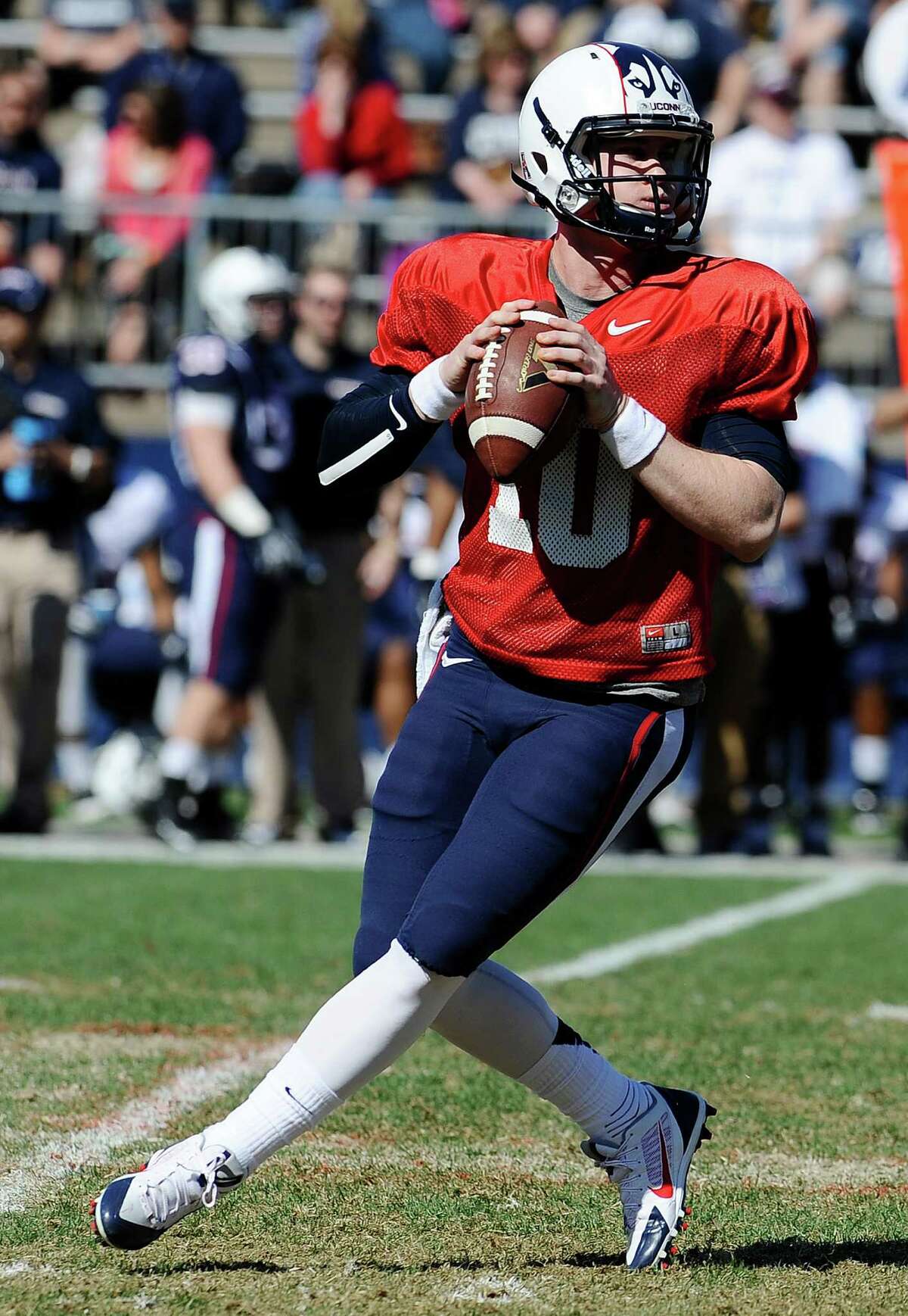 Connecticut quarterback Chandler Whitmer looks down field for a receiver during the first half of UConn's Blue-White spring NCAA college football game at Rentschler Field, Saturday, April 12, 2014, in East Hartford, Conn. (AP Photo/Jessica Hill)