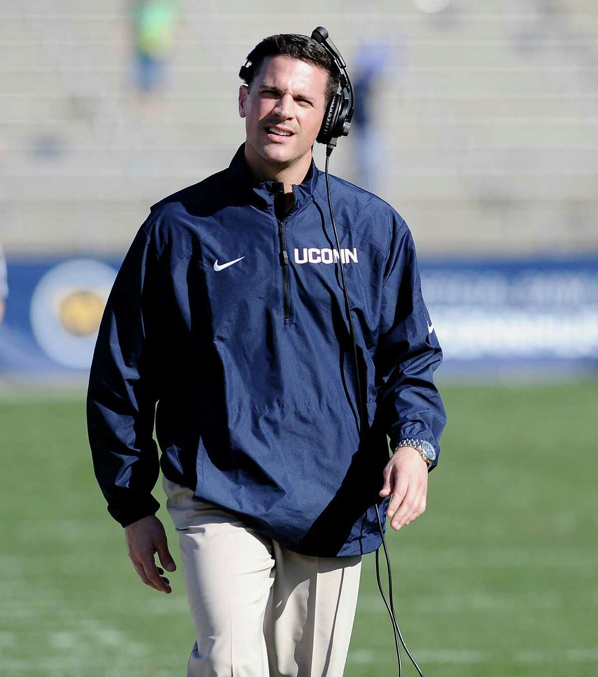 Connecticut head coach Bob Diaco walks up the field during the second half of UConn's Blue-White spring NCAA college football game at Rentschler Field, Saturday, April 12, 2014, in East Hartford, Conn. (AP Photo/Jessica Hill)
