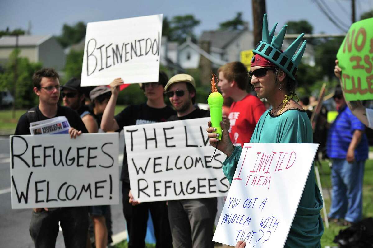 Members of the Industrial Workers of the World Lehigh Valley branch rally in support of the unaccompanied immigrants.