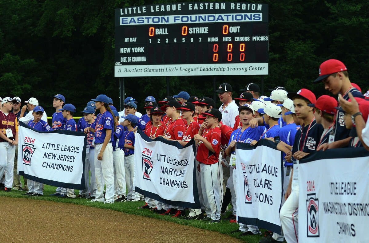 Teams from around New England are lined up on the field before the start of New England little league tournamnent action at Breen Field in Bristol, Conn. on Friday August 1, 2014.