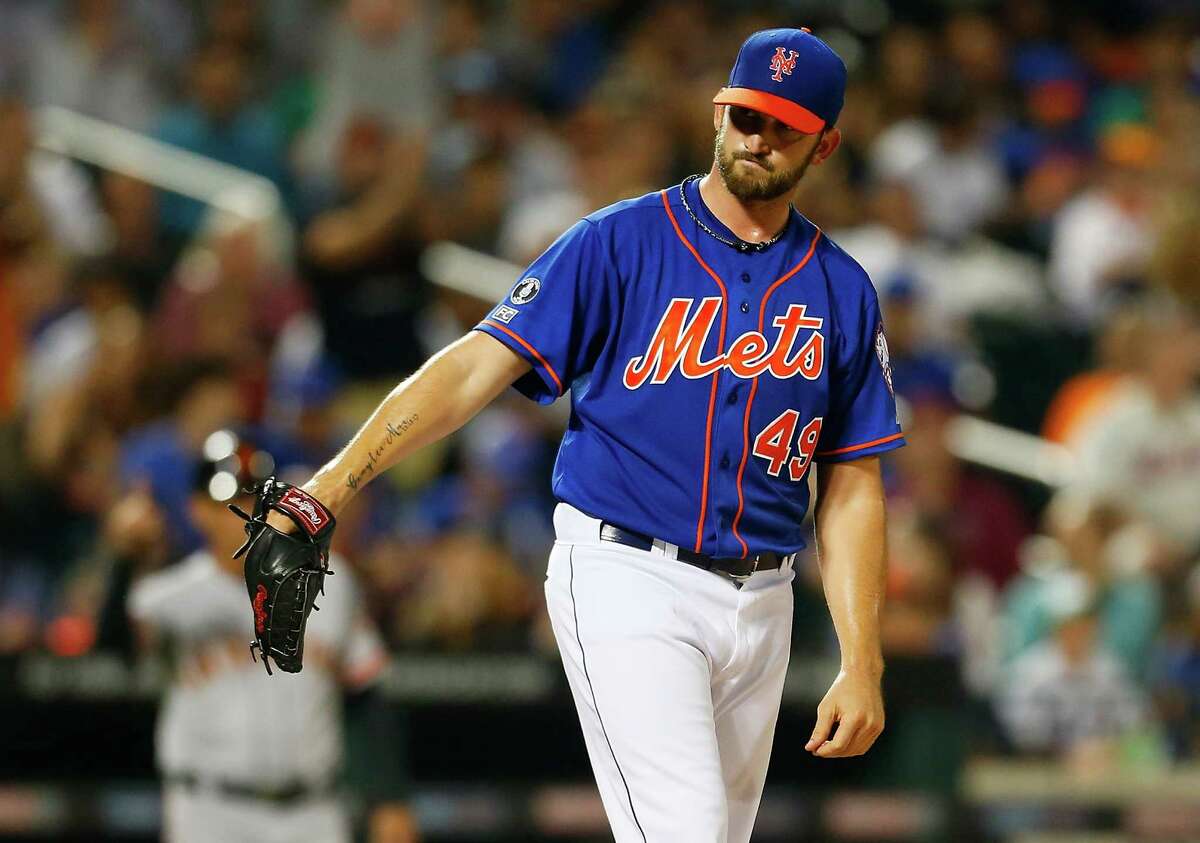 NEW YORK, NY - AUGUST 01: Jonathon Niese #49 of the New York Mets reacts in the seventh inning against the San Francisco Giants at Citi Field on August 1, 2014 in the Flushing neighborhood of the Queens borough of New York City. (Photo by Mike Stobe/Getty Images) ORG XMIT: 477587277
