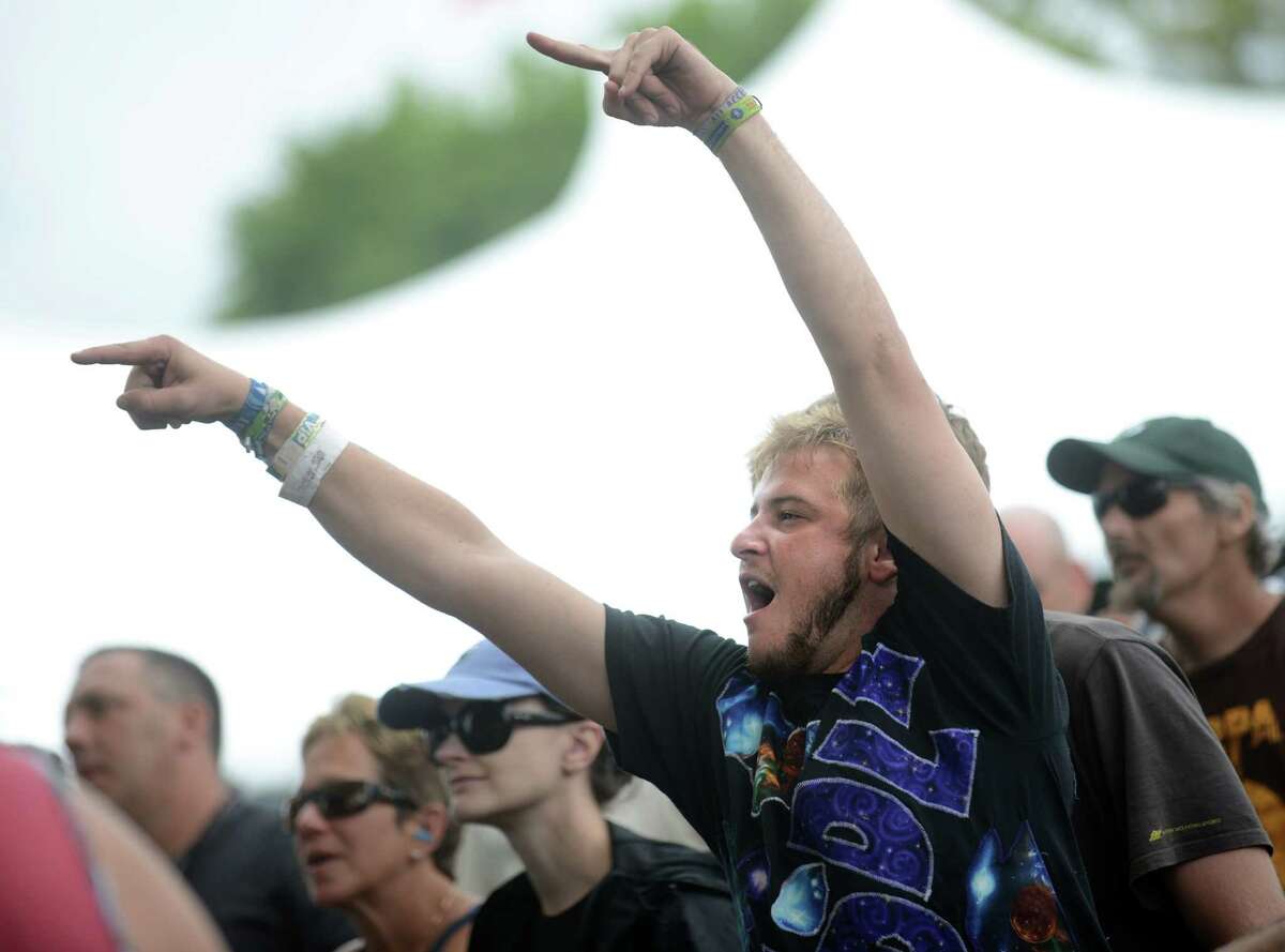 Ryan Dempsey, of Vermont based quartet Twiddle, cheers for Kung Fu as they perform on the main stage during the Gathering of the Vibes music festival Saturday, Aug. 2, 2014, at Seaside Park in Bridgeport, Conn.
