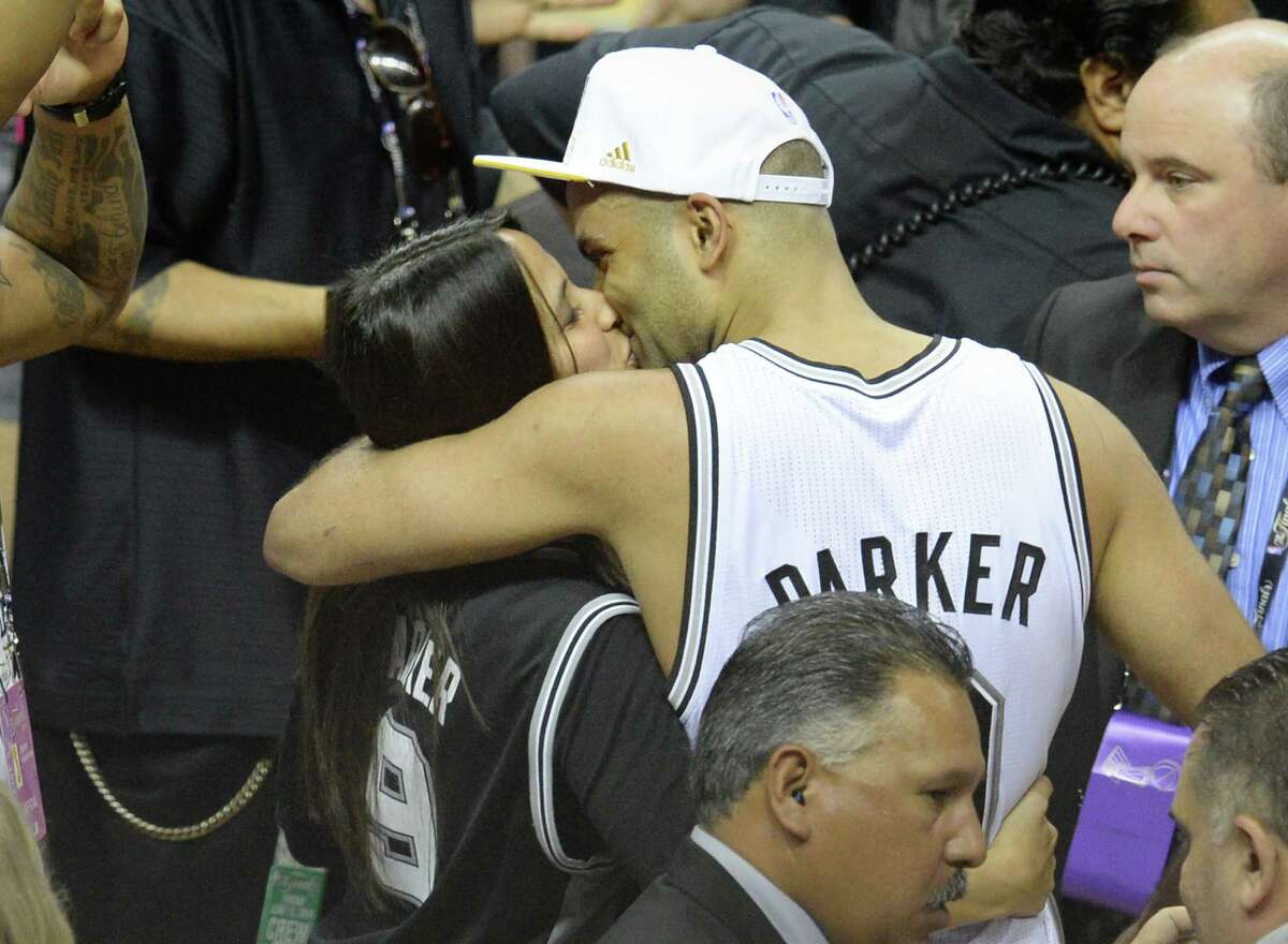 Tony Parker of the San Antonio Spurs kisses Axelle Francine after the Spurs defeated the Miami Heat in the NBA Finals, June 15, 2014 in San Antonio.