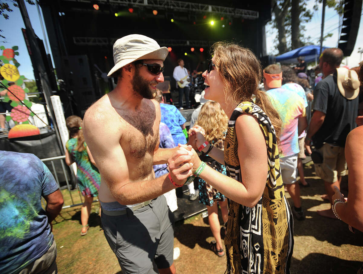 Jacob Sellers and Rebecca Marshburn, both of Savannah, Georgia dance to the music of Donna the Buffalo, playing on the Green Vibes Stage at the 19th annual Gathering of the Vibes Musical Festival at Seaside Park in Bridgeport, Conn. on Sunday, August 3, 2014.