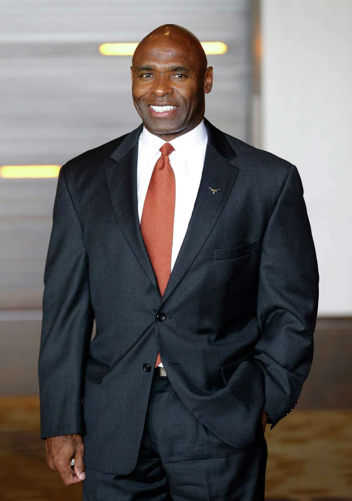 Texas coach Charlie Strong smiles for a photo during the NCAA college Big 12 Conference football media days in Dallas, Tuesday, July 22, 2014. (AP Photo)