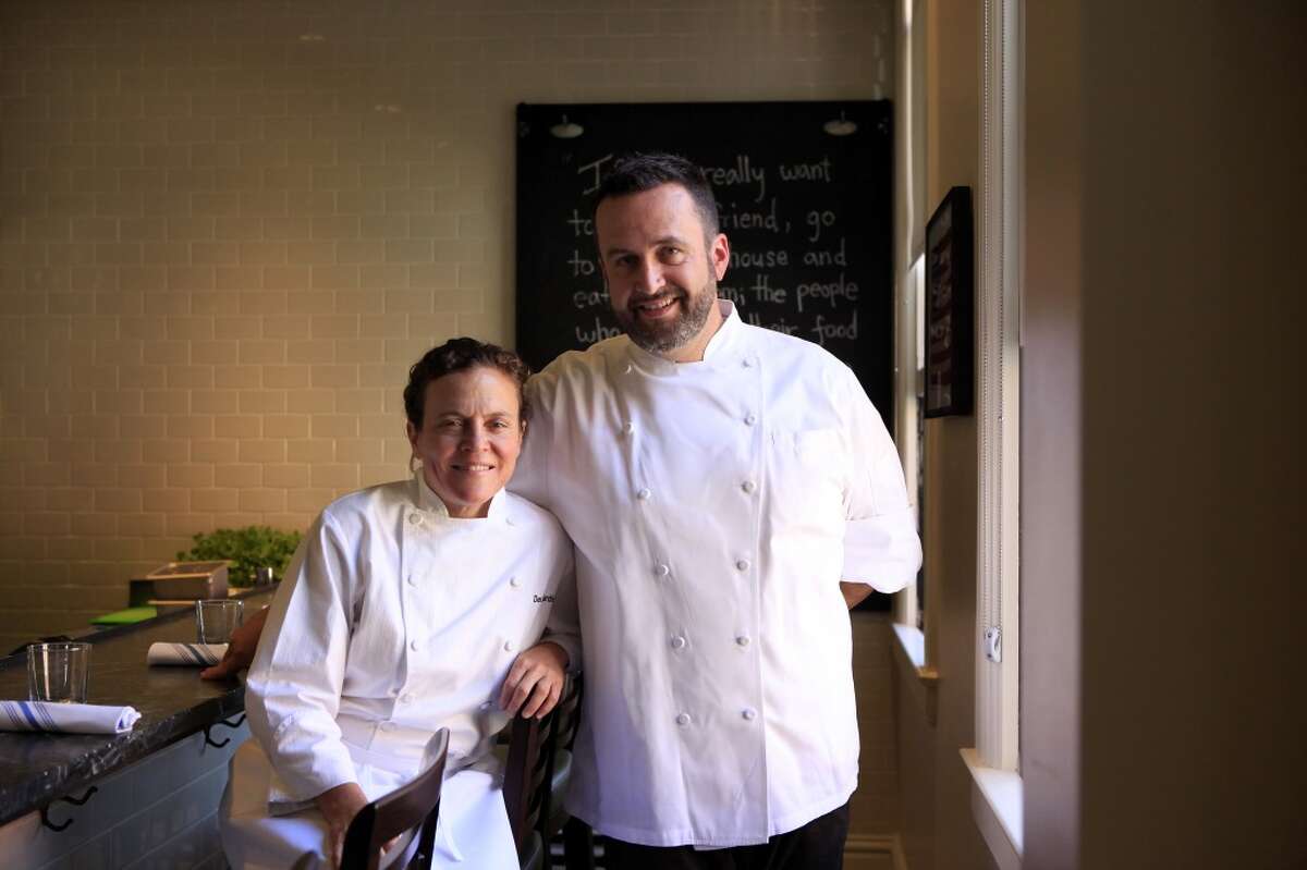 Traci Des Jardins poses for a portrait with Chef Robbie Lewis at her new restaurant The Commissary in San Francisco, CA, Thursday, July 24, 2014.