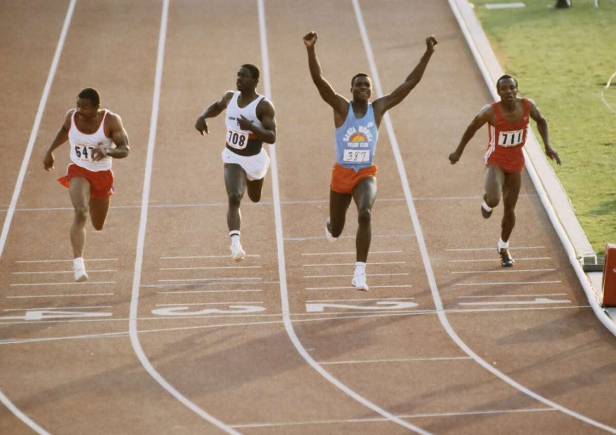 TRIALS: Carl Lewis #387 wins the final of the Men's 100m event during 1984 United States Olympic Track and Field Trials at the Los Angeles Memorial Coliseum on June 17, 1984 in Los Angeles, California . Also visible are Ron Brown #647, Emmit King #708 and Calvin Smith #711. (Photo by David Madison/Getty Images)