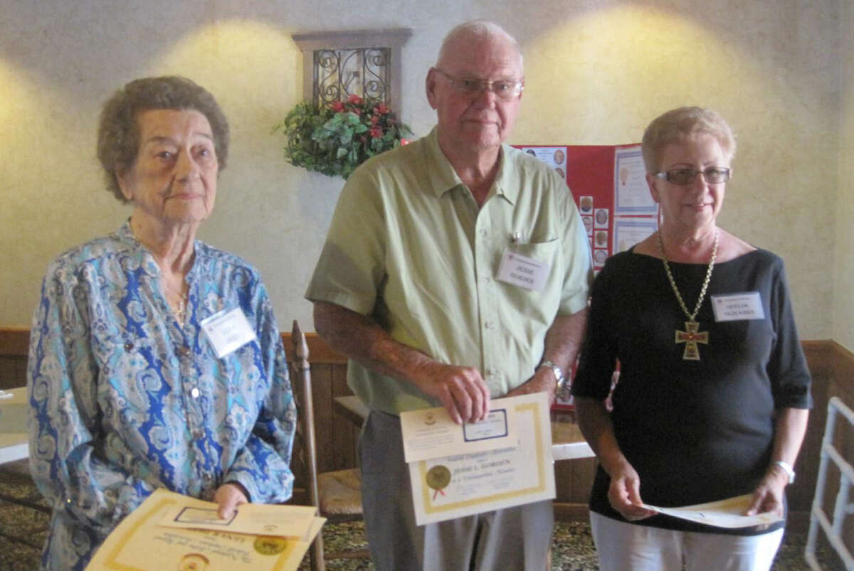 Pictured left to right: NARFE Chapter members Lena Dees, Jesse Gorden and Ofelia Olivares receiving Distinguished Member Certificates at the July 2014 meeting.