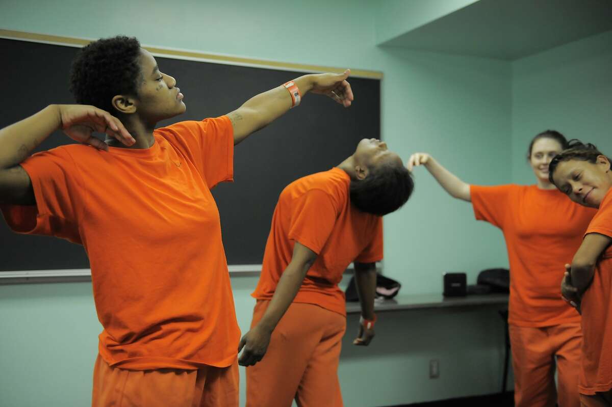 From left, inmates Demetrius Carroll, Erica Jones, Tasha Anderson and Marisabela Sarria dance during a "ecstatic" dance class by teacher Sylvie Minot at the San Francisco County Jail on July 17, 2014 in San Francisco, CA. Sylvie Minot leads dance classes inside the SF County Jail to help bring inmates inner peace. Minot also leads classes for the public in Marin, and for vets at the VA clinic.