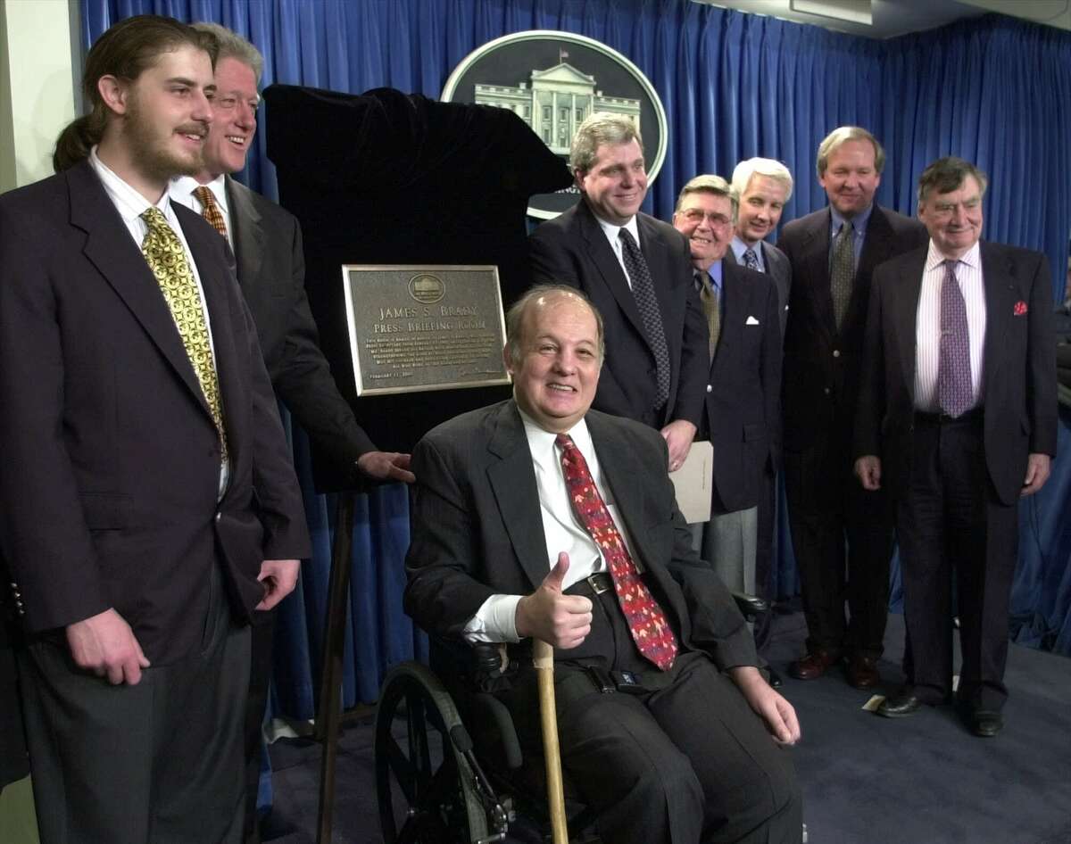 James Brady, the former press secretary for President Ronald Reagan, was the center of attention after the dedication ceremony for the James S. Brady Press Briefing Room in February 2000.