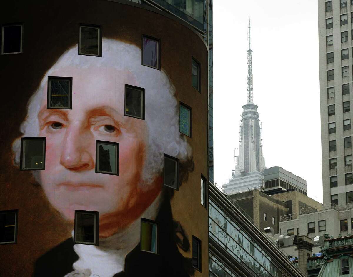 The work "George Washington, c. 1821" by Gilbert Stuart, is seen on the side of the NASDAQ building as part of the "Art Everywhere US: A Very Very Big Art Show," August 4, 2014 in Times Square in New York. A nationwide display of images of artwork will appear in public locations beginning August 4, and continue throughAugust 31. Electronic billboards will display a rotating selection of the 58 images of classic and contemporary American artworks during the same time frame. 