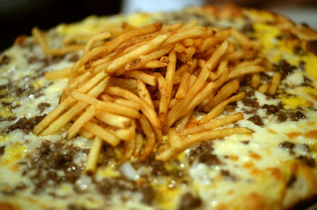 The Cheese burger Cheese Burger pizza at Crown Pizza in Beaumont. Photo taken Thursday, July 24, 2014 Guiseppe Barranco/@spotnewsshooter