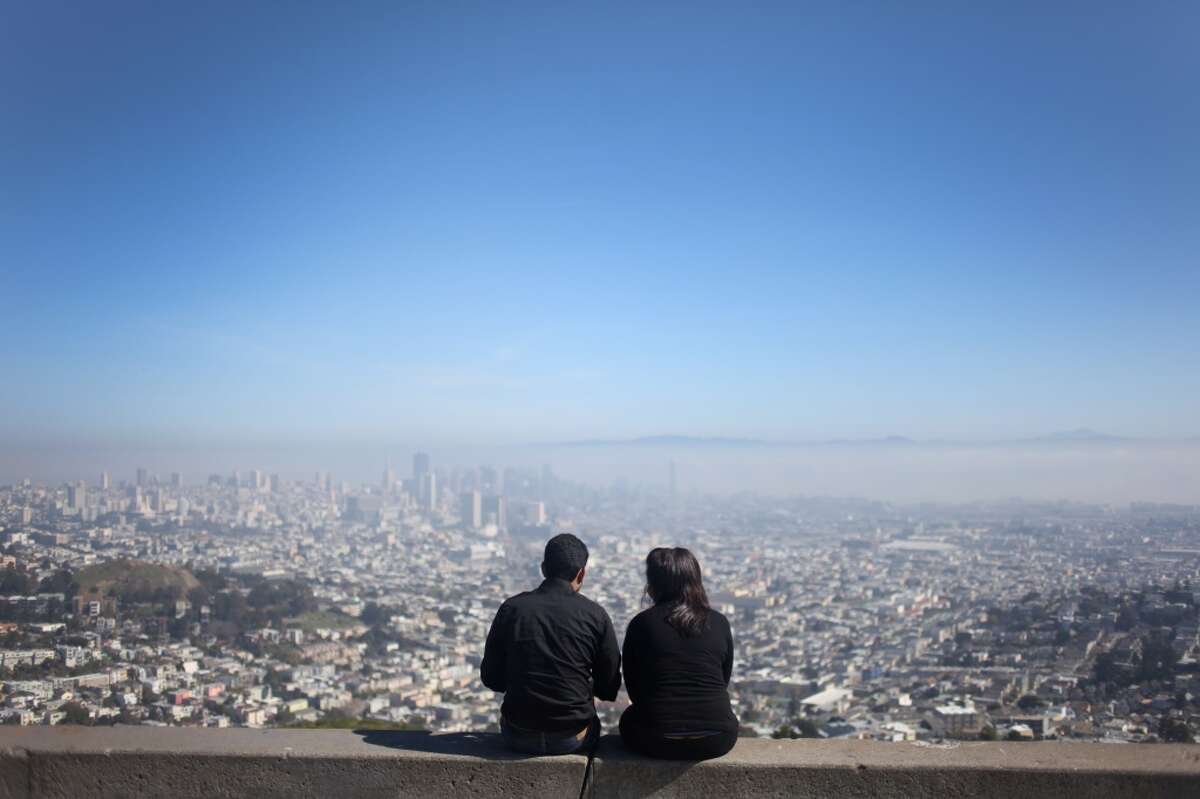In this file photo, a couple takes in the view from Twin Peaks in San Francisco.
