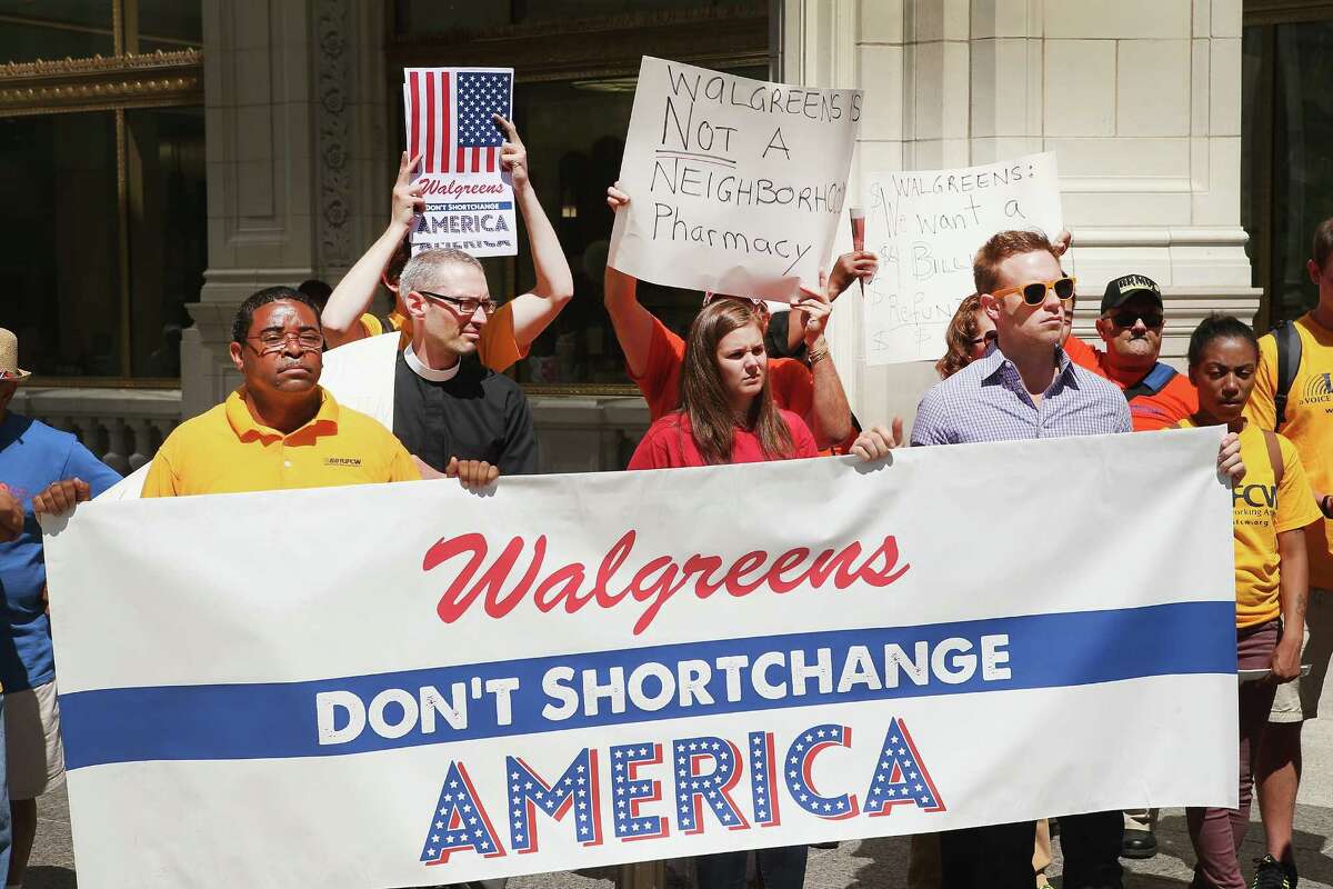 Demonstrators last month protest in Chicago against the possibility of Walgreen Co. reincorporating itself overseas to lower its tax bill.